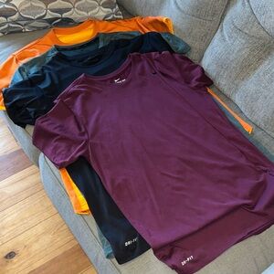 Four Nike Men’s Large Shirts